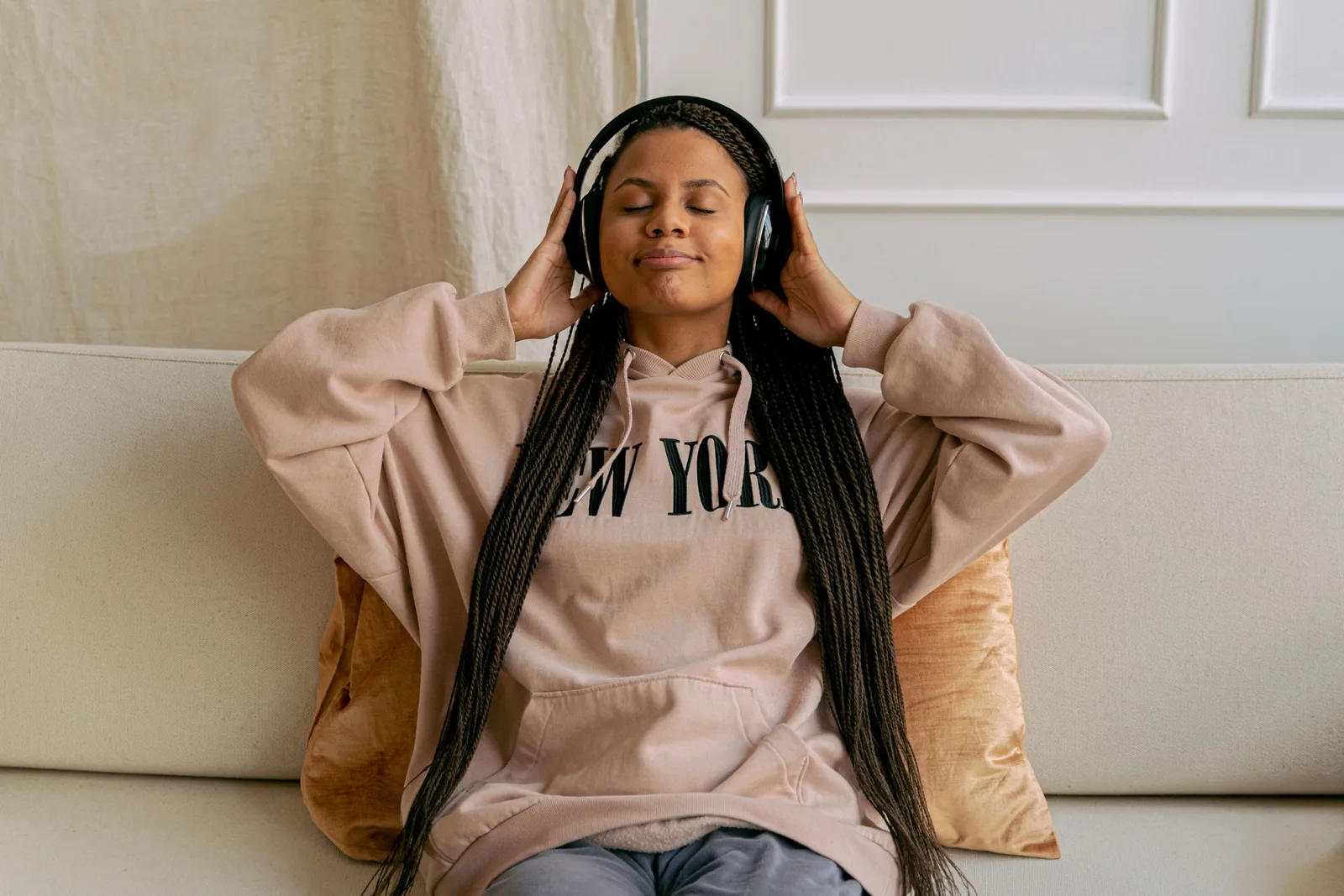 woman resting on a sofa with eyes closed — how to meditate by listening to yourself